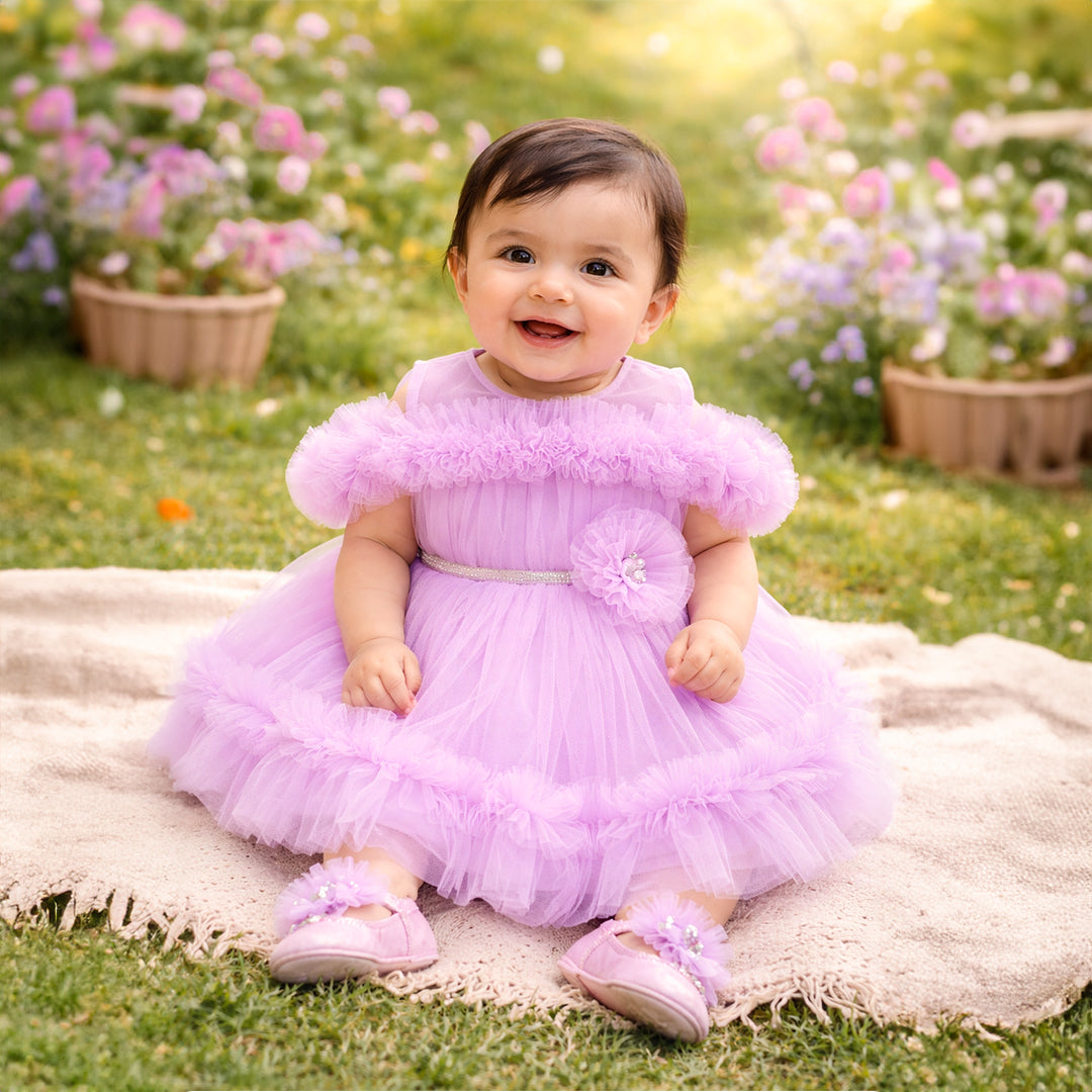 Lilac baby girl tulle dress with ruffle detailing
Soft, breathable fabric for all-day comfort
Layered tulle for a voluminous, elegant look
Delicate waist embellishment for added charm
Ideal for birthdays, parties, and photoshoots
Matching accessories for a complete outfit